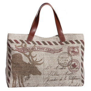 This L994-POST Traveller Tote 23"x13"x6" with Bridle Leather straps, Designed and Printed on a Textured Fabric with the Vintage Canada Flag on one side, part of the Lady Rosedale Vintage Canadiana Collection